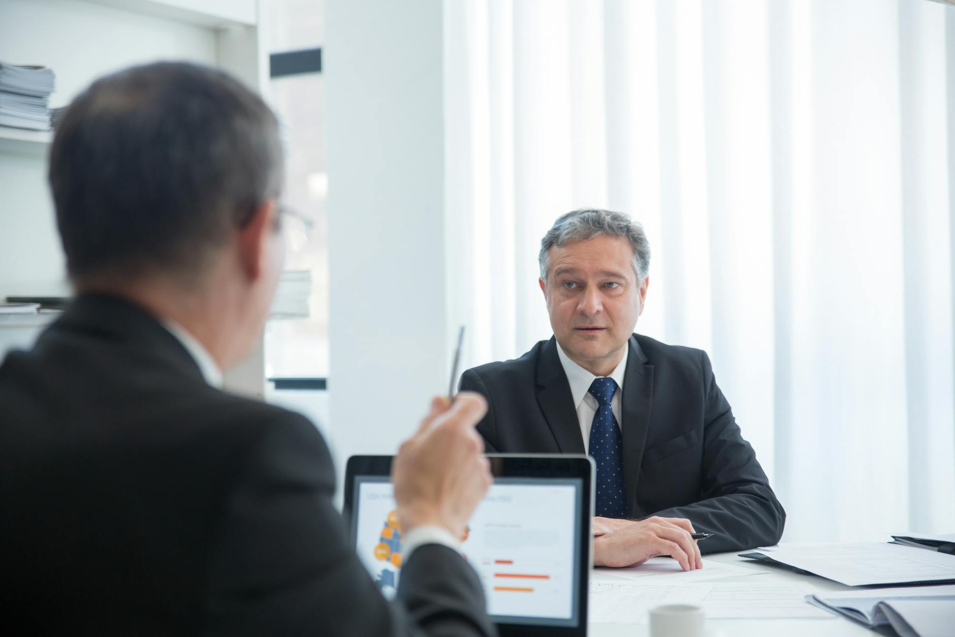 The Asset-Under-Management Model vs. The Interest-Spread Model